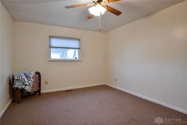 spare room with ceiling fan and carpet floors