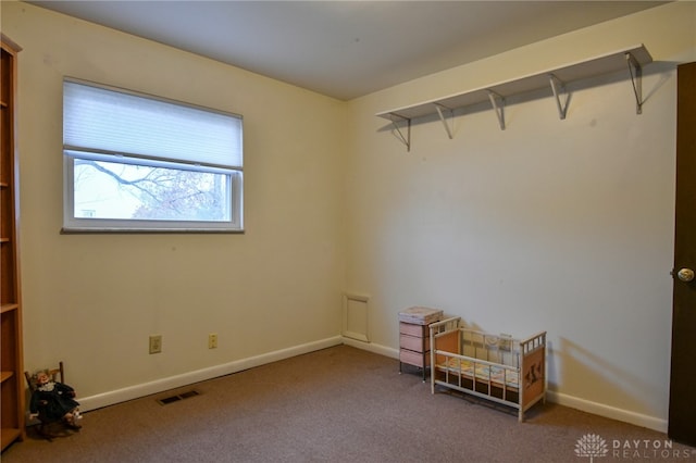 unfurnished room featuring carpet flooring