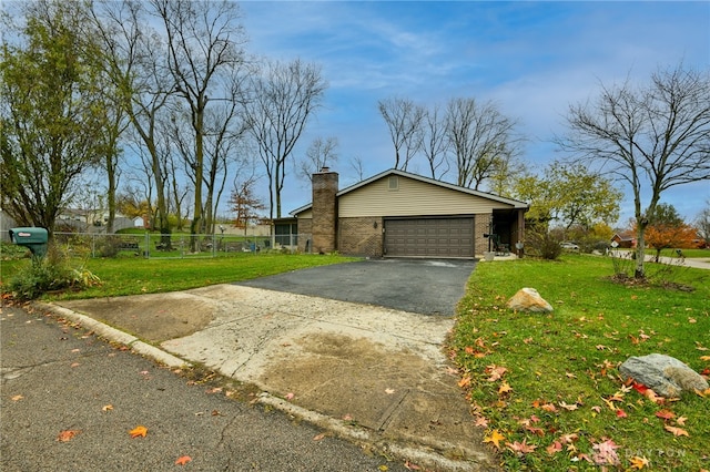 view of front facade featuring a front yard and a garage