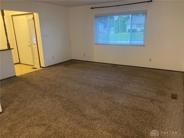 spare room featuring carpet flooring