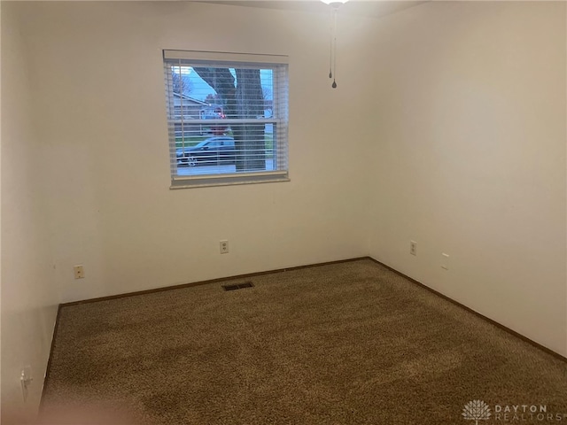 unfurnished room with carpet flooring