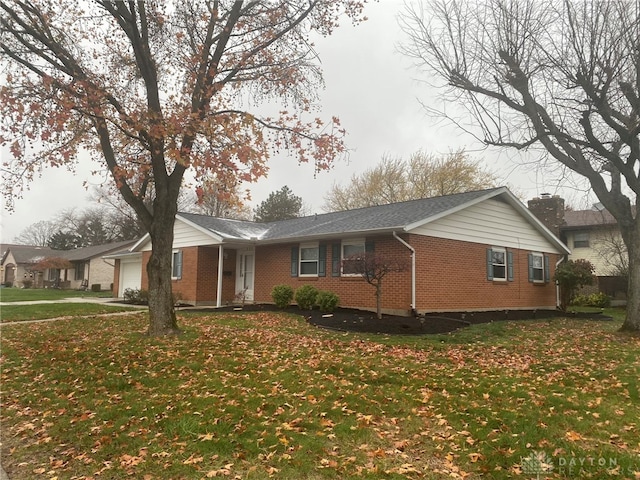 view of front of home with a garage and a front yard