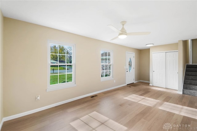 interior space with a closet, ceiling fan, and light hardwood / wood-style flooring