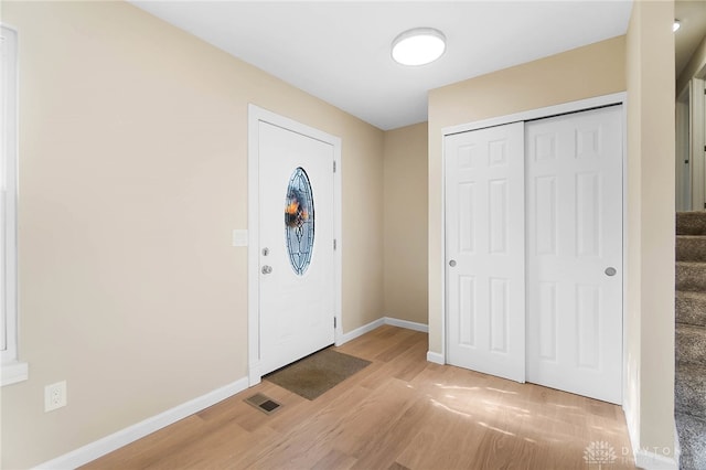 foyer with light wood-type flooring