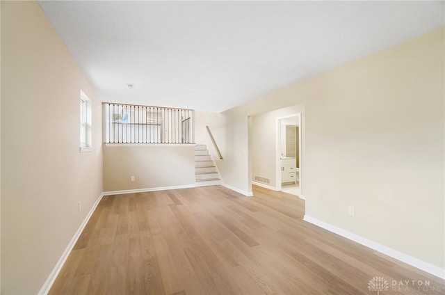 unfurnished living room with light wood-type flooring