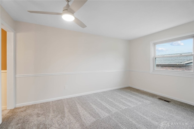 carpeted empty room with ceiling fan