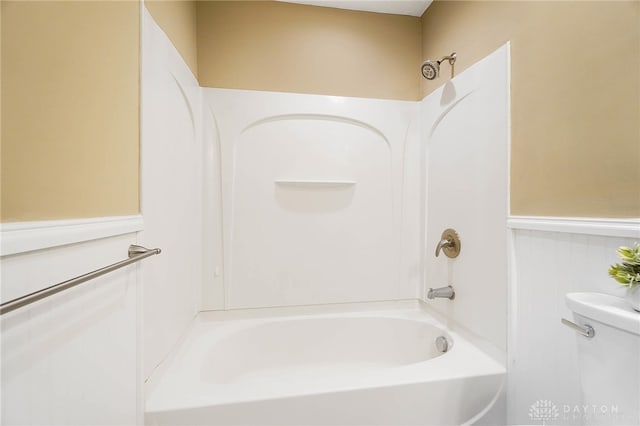 bathroom with toilet and tub / shower combination