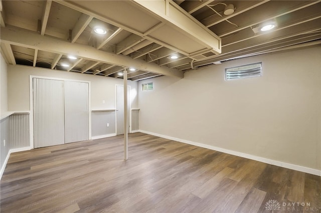 basement featuring hardwood / wood-style flooring