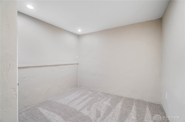 unfurnished room featuring carpet flooring