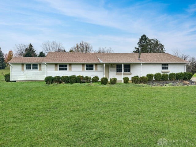 ranch-style house with a front lawn