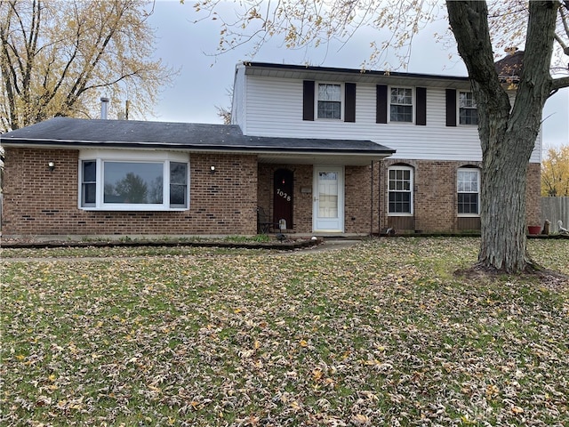 view of property featuring a front yard