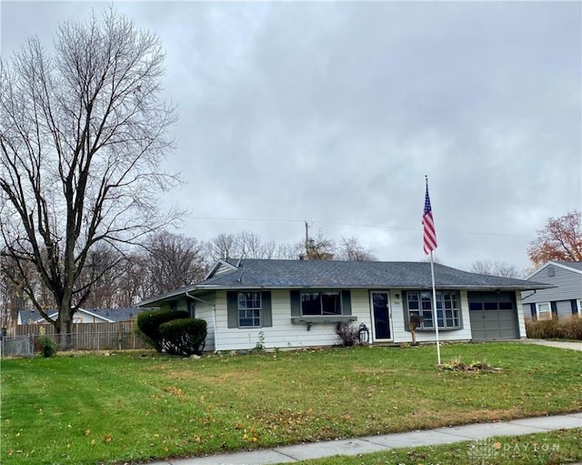 single story home featuring a garage and a front yard