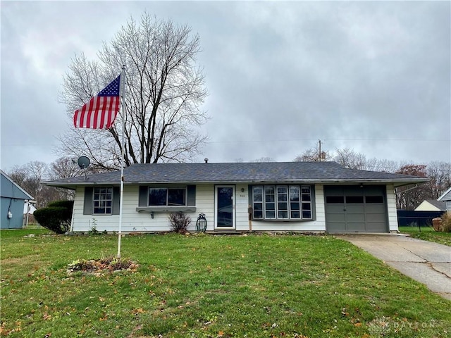 ranch-style house featuring a garage and a front yard