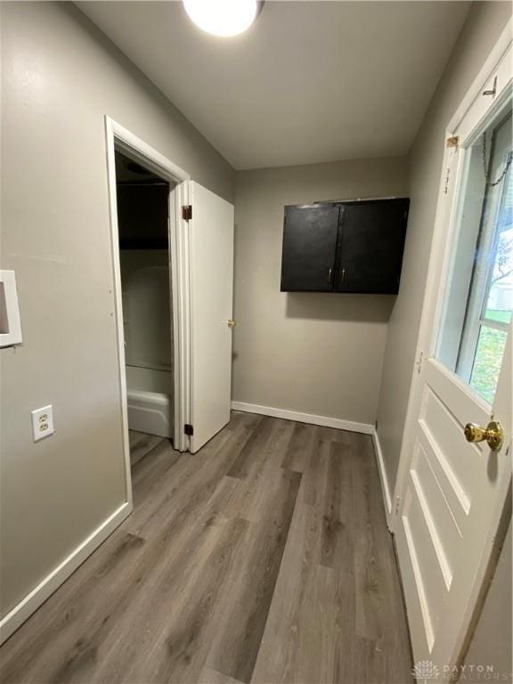 corridor featuring hardwood / wood-style floors