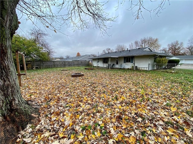 view of yard with an outdoor fire pit