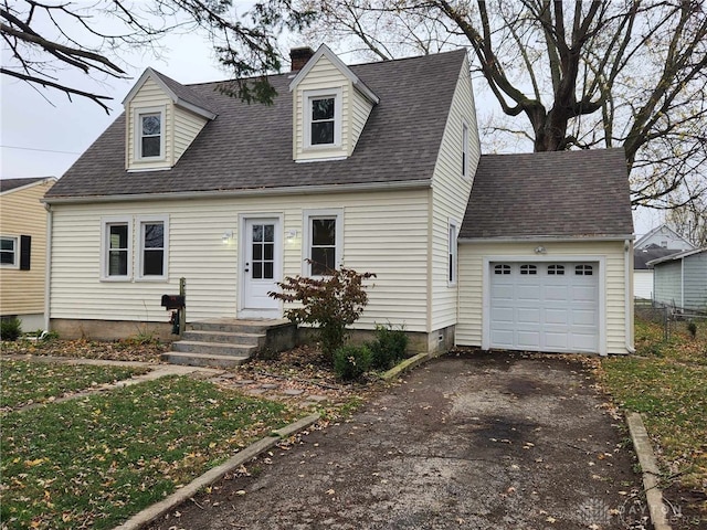 new england style home featuring a garage