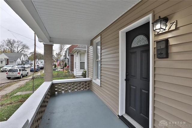 doorway to property featuring covered porch