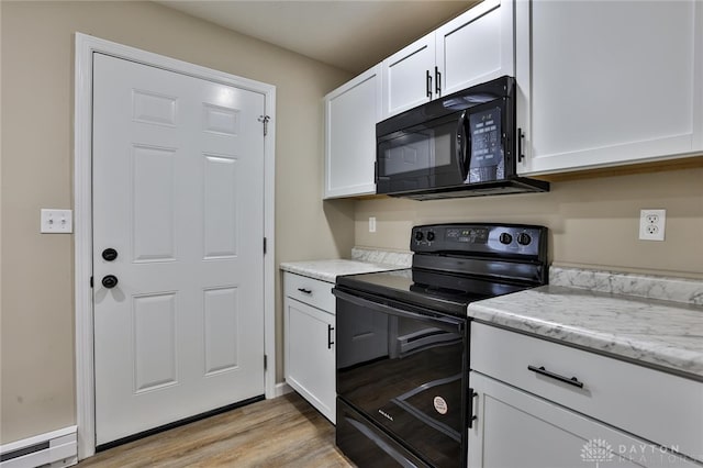 kitchen with white cabinetry, a baseboard radiator, light stone counters, light hardwood / wood-style floors, and black appliances