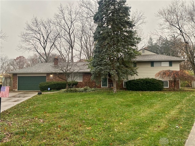 view of front of house with a garage and a front lawn