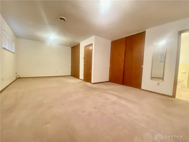 interior space featuring light colored carpet