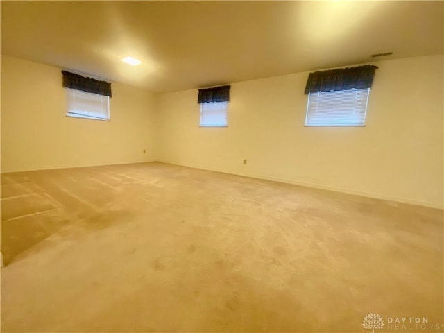 basement with carpet flooring and plenty of natural light