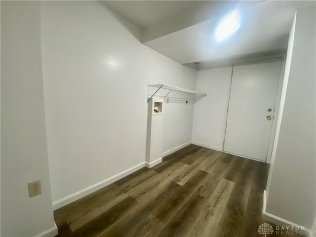 washroom featuring hookup for a washing machine and dark wood-type flooring