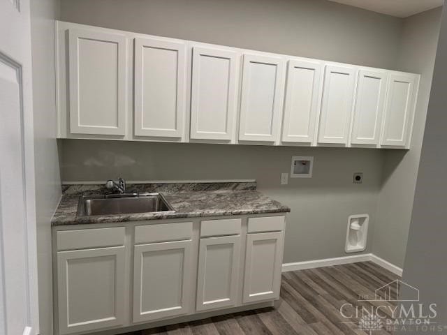 laundry area featuring sink, cabinets, dark wood-type flooring, washer hookup, and electric dryer hookup