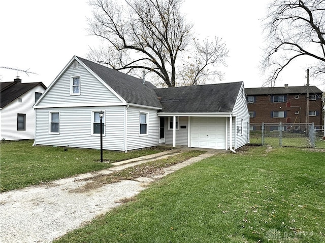 view of front facade with a front yard and a garage