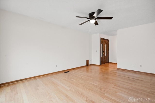 spare room featuring ceiling fan and light hardwood / wood-style flooring