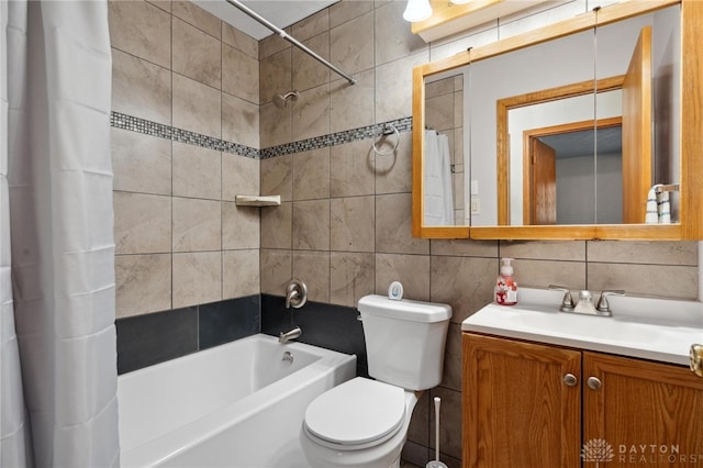 full bathroom with vanity, backsplash, shower / bath combination with curtain, toilet, and tile walls