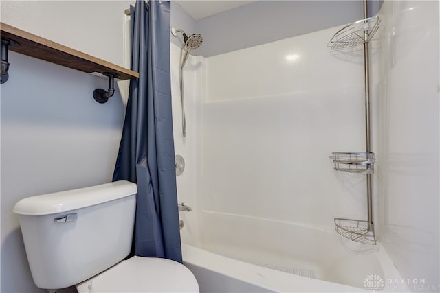 bathroom with toilet and shower / tub combo with curtain