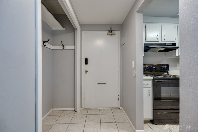 entryway with light tile patterned floors