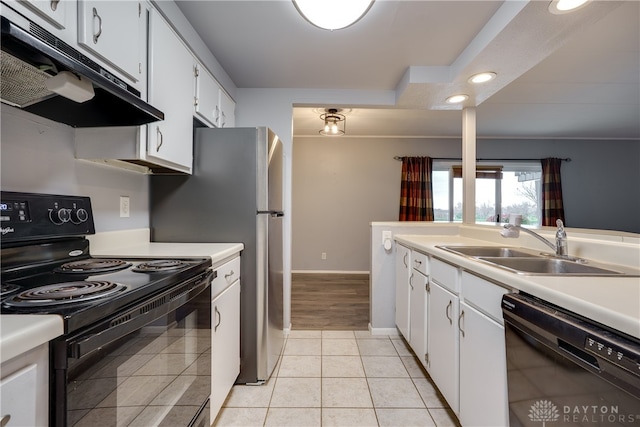 kitchen with black appliances, white cabinets, light tile patterned floors, and sink