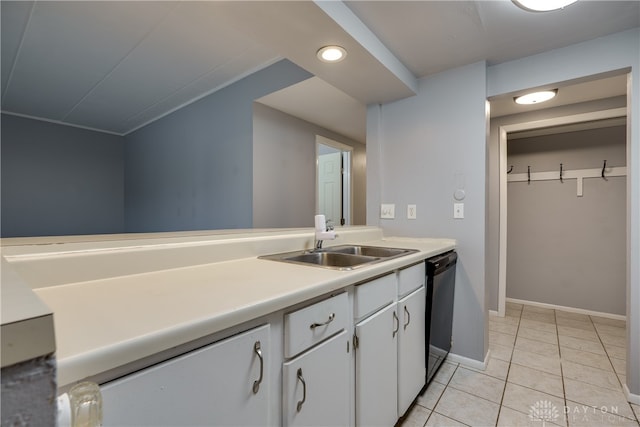 kitchen with white cabinets, dishwasher, light tile patterned floors, and sink