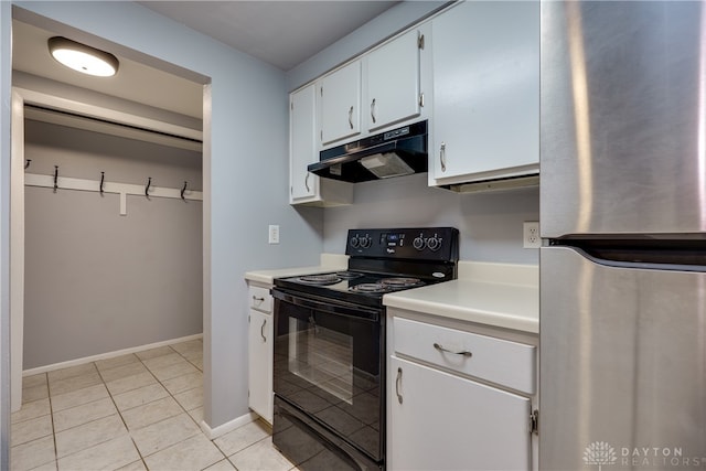 kitchen featuring white cabinets, stainless steel fridge, light tile patterned floors, and black range with electric stovetop