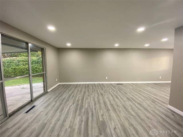 spare room featuring light hardwood / wood-style floors