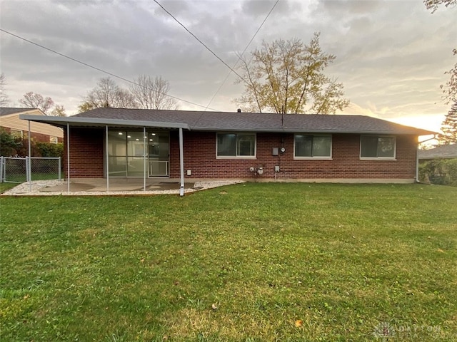 back of house with a yard