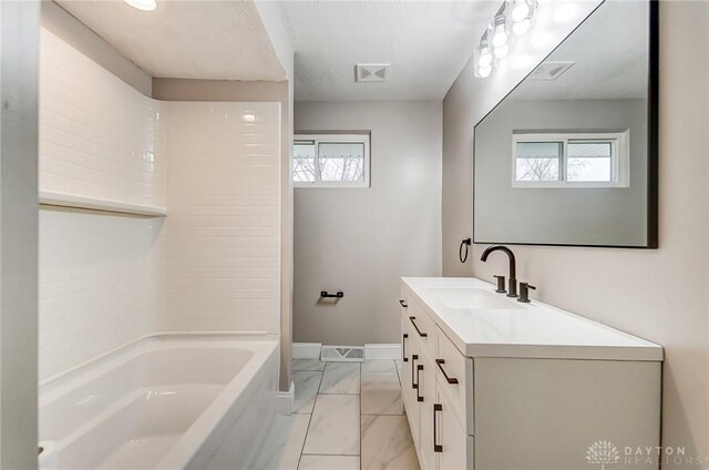 bathroom featuring vanity and bathtub / shower combination