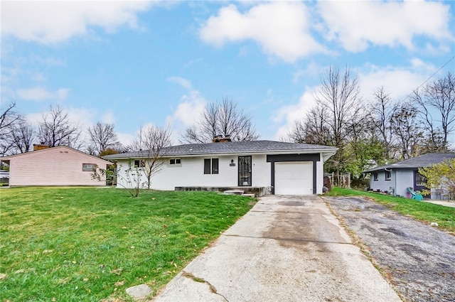 single story home with a front yard and a garage