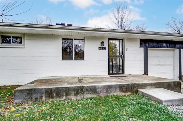 entrance to property with a garage