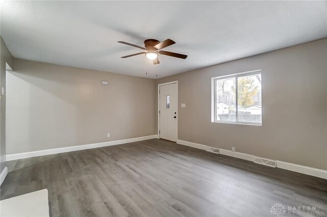 unfurnished room featuring hardwood / wood-style flooring and ceiling fan