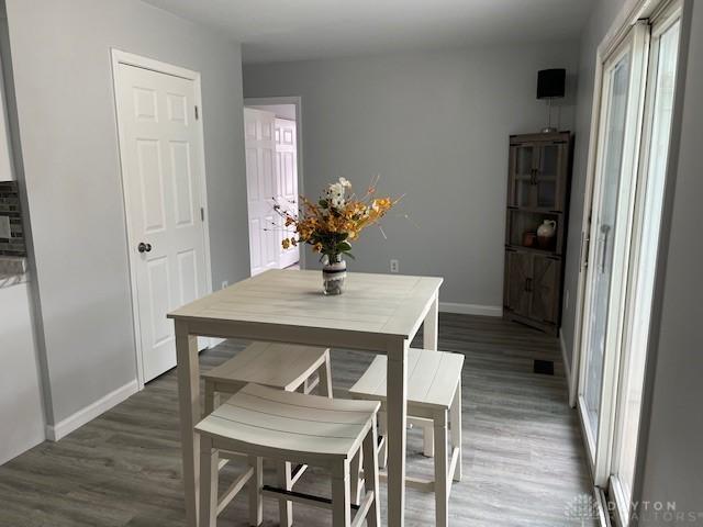 dining space featuring dark hardwood / wood-style flooring