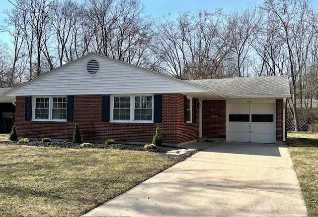 single story home with brick siding, driveway, a front yard, and a garage