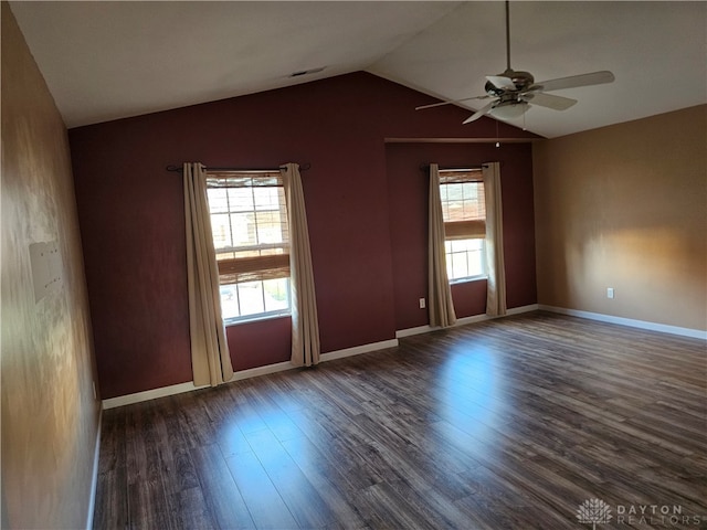 unfurnished room featuring lofted ceiling, dark hardwood / wood-style floors, and ceiling fan