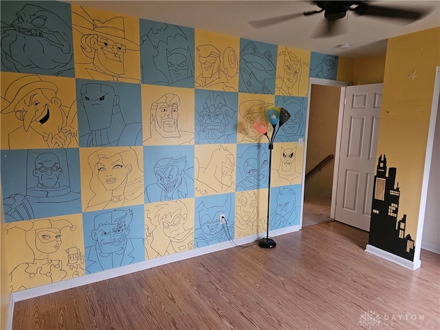 unfurnished room featuring hardwood / wood-style flooring and ceiling fan