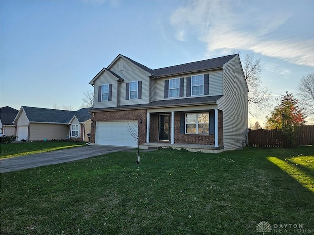 view of front property featuring a garage and a lawn