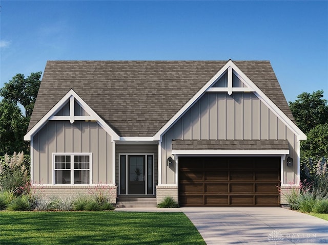 view of front of house with a front lawn and a garage