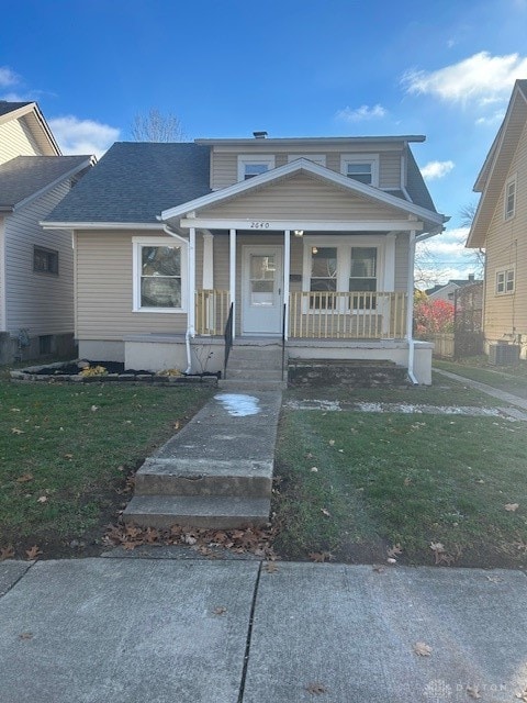 bungalow-style home with a front yard