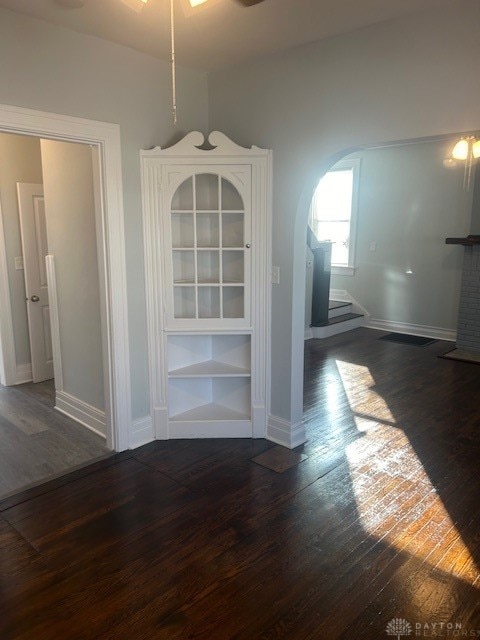 unfurnished dining area featuring dark hardwood / wood-style flooring