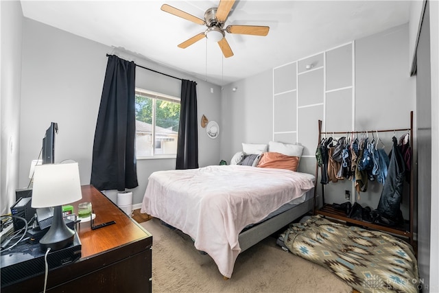 carpeted bedroom featuring ceiling fan